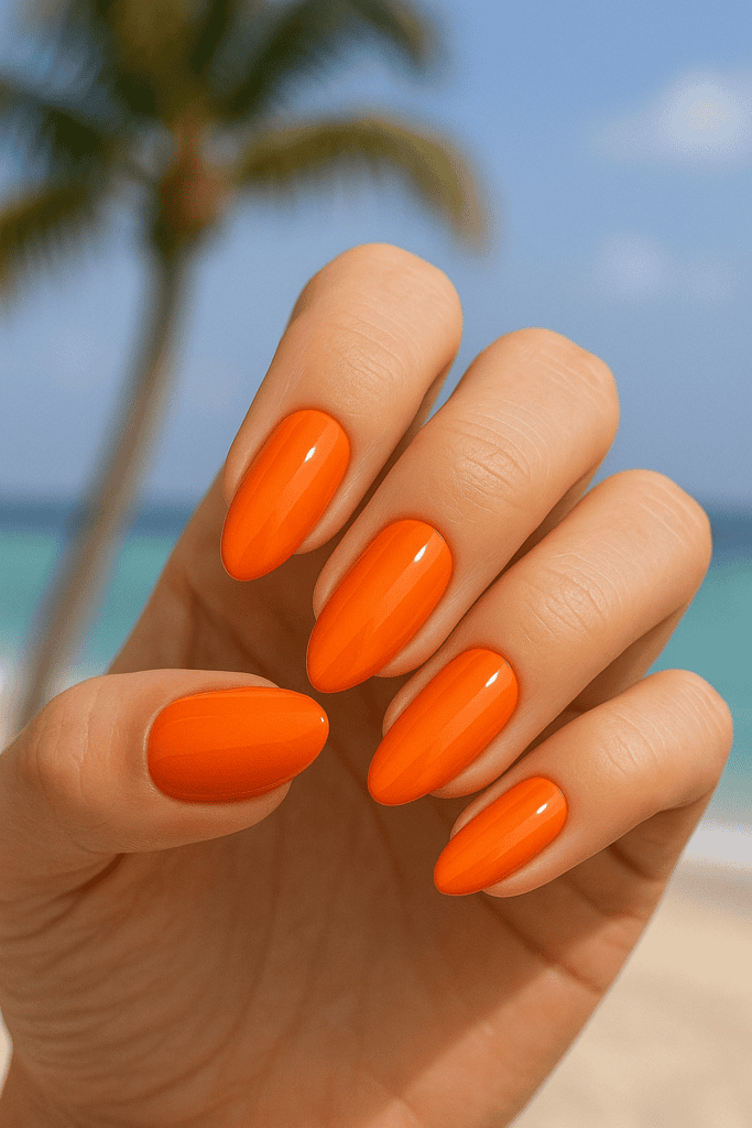 Tangerine orange summer nail polish with tropical background