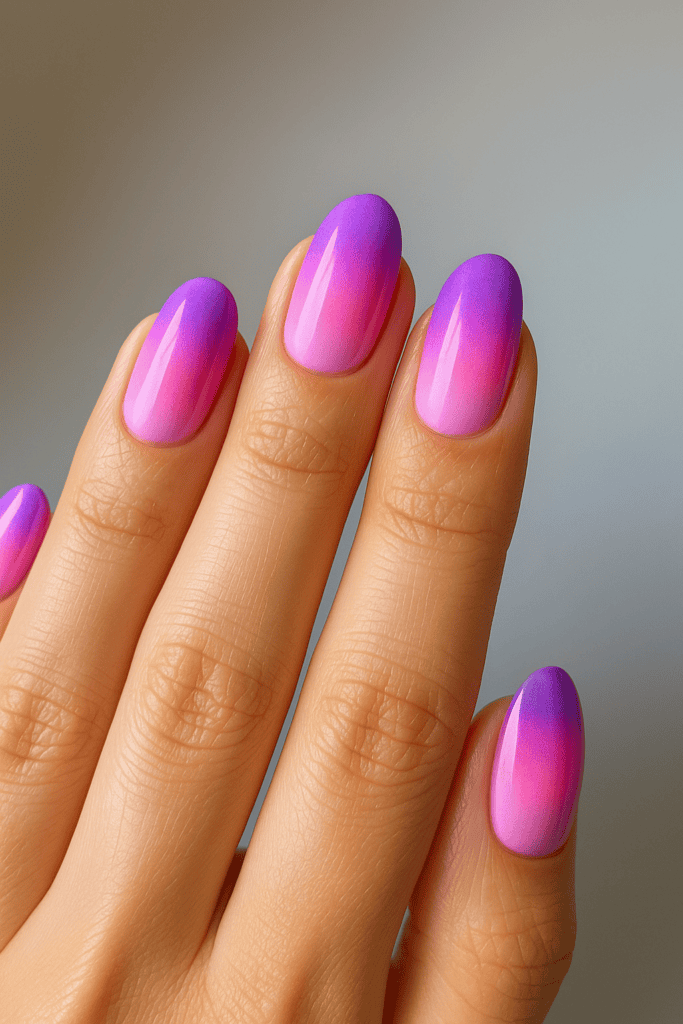Ombre gradient nail art with pink and purple shades