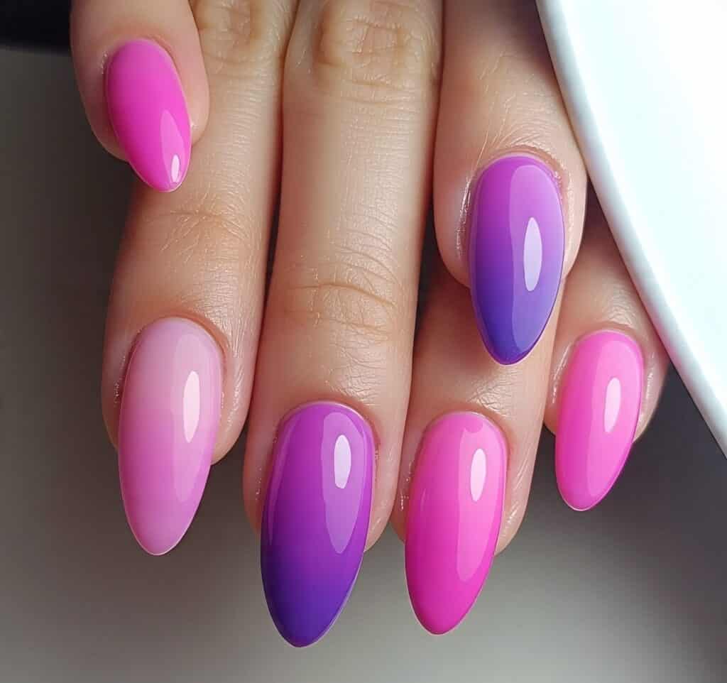Ombre gradient nail art with pink and purple shades