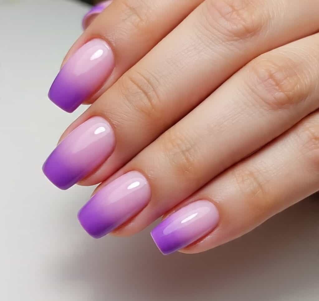 Ombre gradient nail art with pink and purple shades